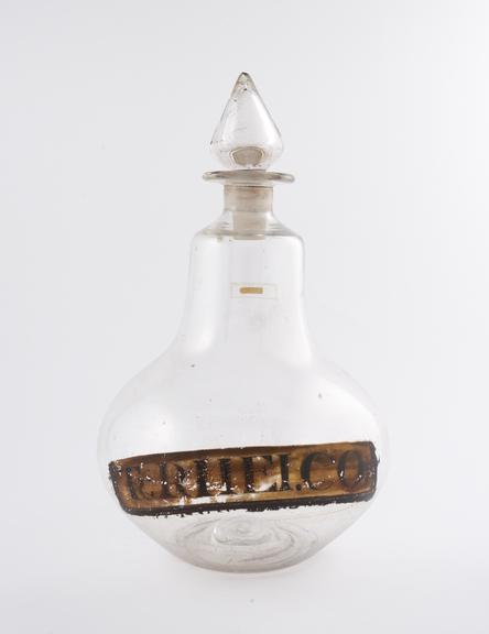 Glass carboy, with conical stopper, labelled,TR:RHEI.CO:''