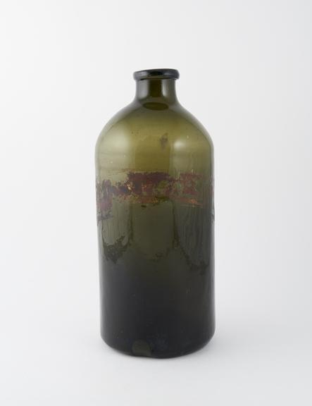 Storage bottle, green glass, label obscured, English