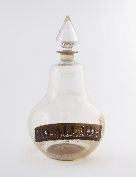 Glass carboy, with conical stopper, labelled TR:CALUMB''