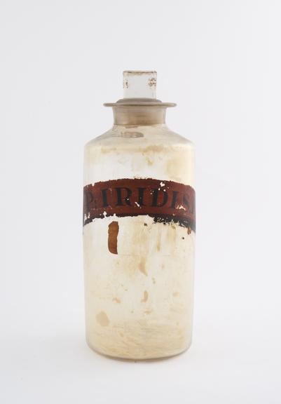 Bottle, clear glass, trace contents, for powdered orris