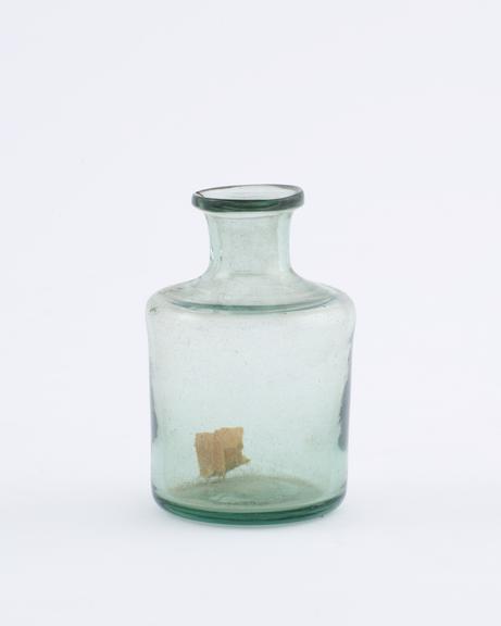 Green glass bottle, cylindrical, pontil mark on base