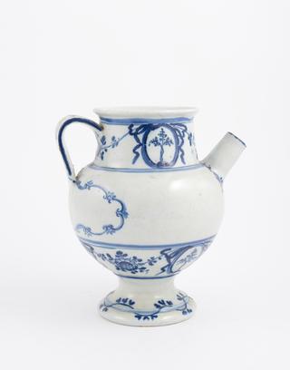 Blue and white syrup jar with dog and spoon on handle