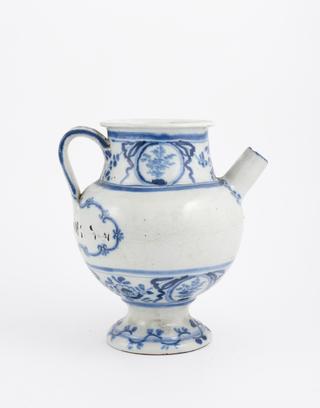 Blue and white syrup jar with dog and spoon on handle