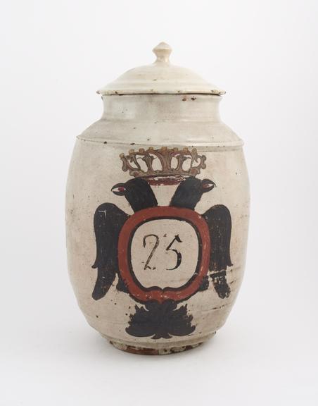 Tin-glazed earthenware drug jar, barrel-shaped, labelled C