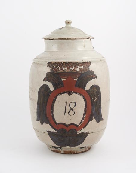 Tin-glazed earthenware drug jar, barrel shaped, labelled BICARB