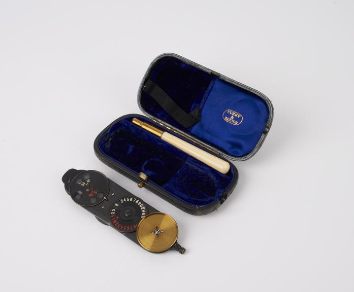 Morton's type ophthalmoscope in black leather covered case