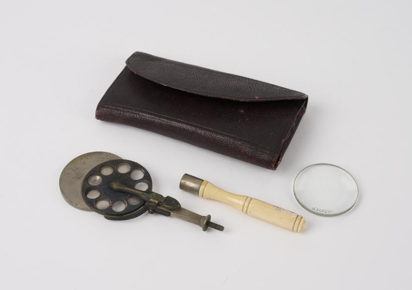 Ophthalmoscope, steel, glass, and ivory, in leather wallet