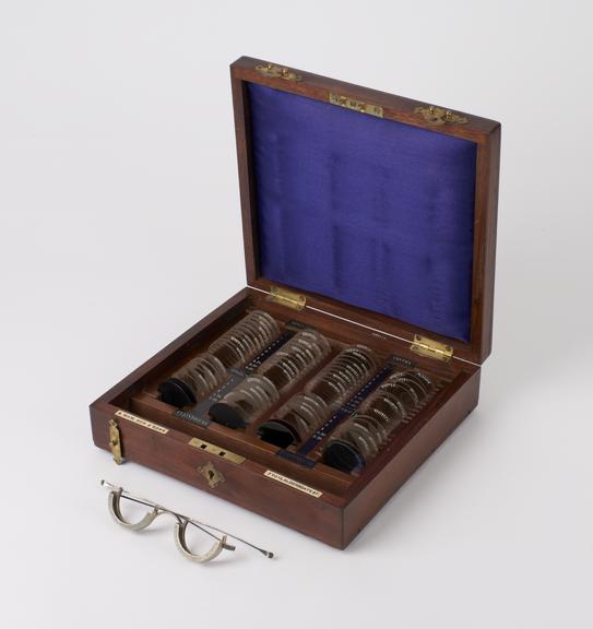 Trial case, wooden, containing 72 trial lenses and trial frame