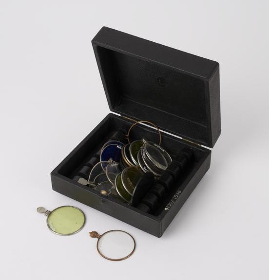 Rectangular leather covered case containing 25 lenses of