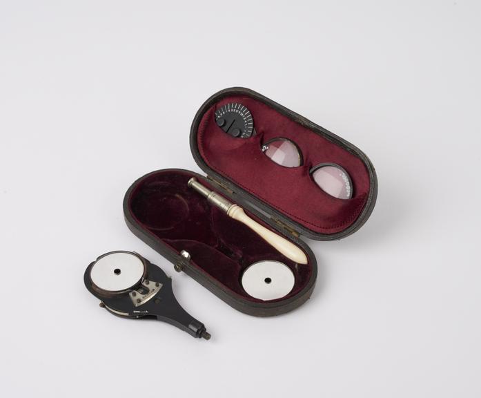 Ophthalmoscope, in case with handle, lenses, mirrors and discs