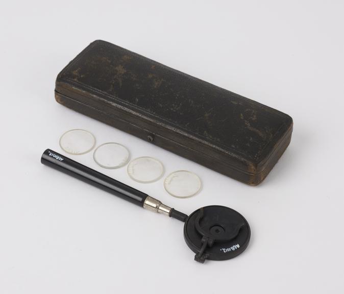 Liebreich's type ophthalmoscope with 4 extra lenses in