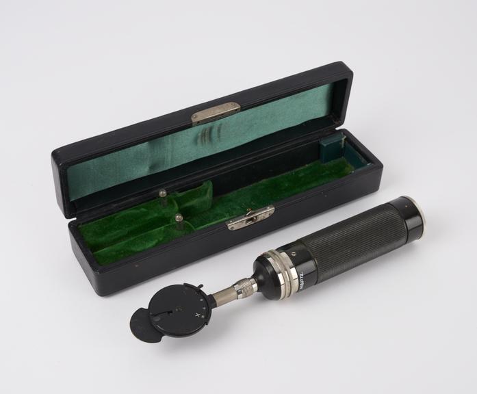 Battery operated ophthalmoscope in a case, belonged to T. D