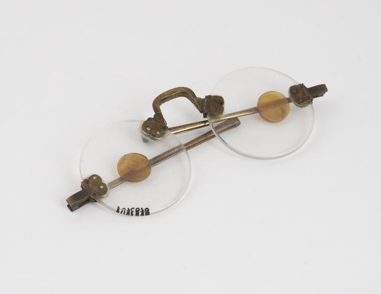 Transverse folding rimless spectacles, brass with shell ends