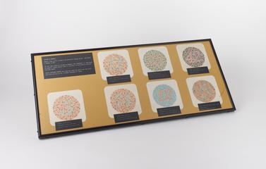 Board containing seven Ishihara Plates