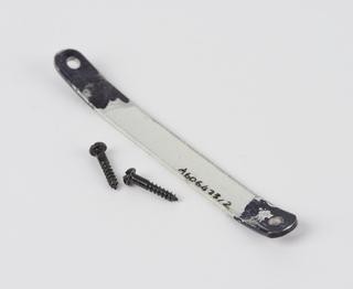 Bracket and screws for shop sign in the shape of pince-nez spectacles