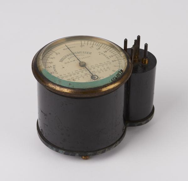 Cylindrical optometer, brass mounted, on 3 ball feet, made by D