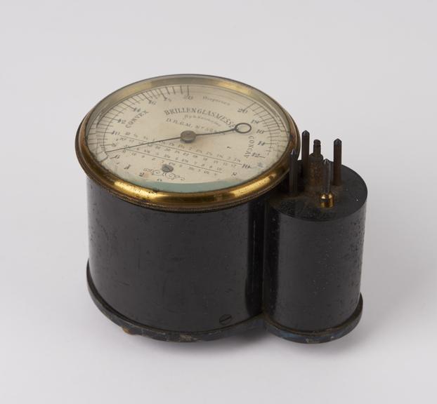 Cylindrical optometer, brass-mounted, on 3 ball feet, made by D