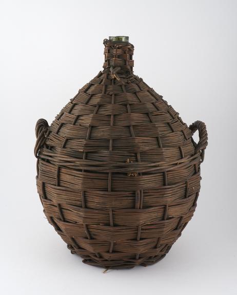 Late 19th century green glass carboy in Wicker protector