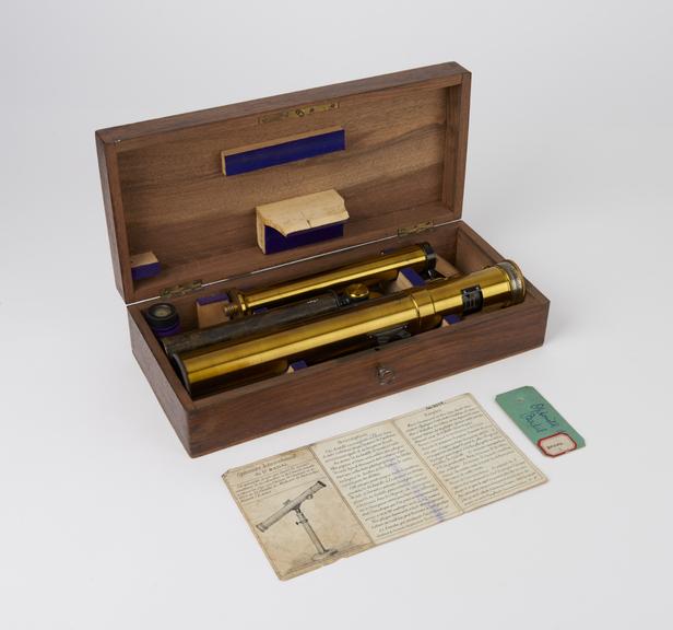 Polished brass optometer and stand, in rectangular wooden case