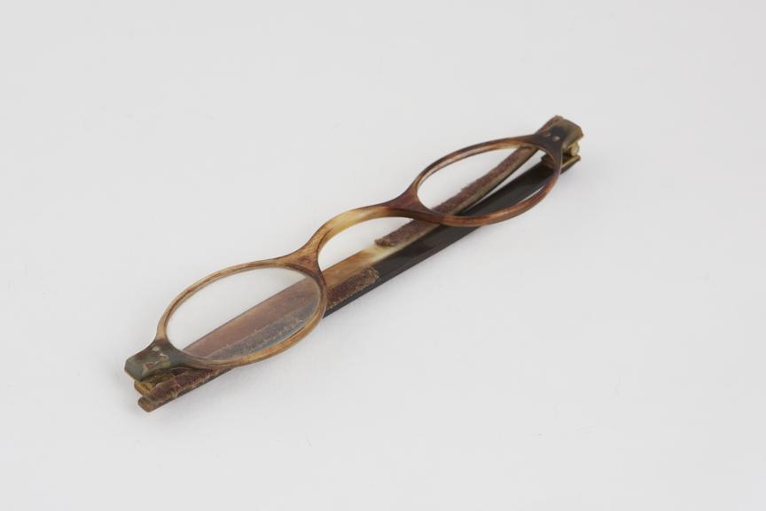 Straight spectacles, horn frames painted to resemble