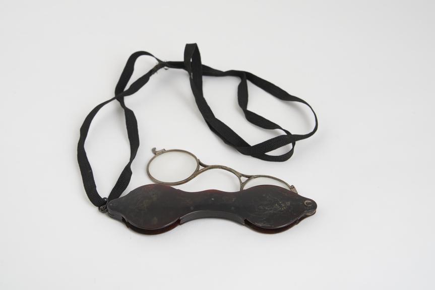 Hand folding spectacles, tortoiseshell and silver, with ribbon