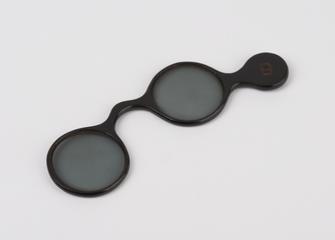 Pair of green tinted lenses in horn lorgnette frame