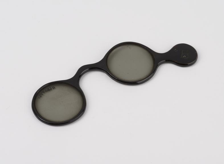 Pair trial lenses, lightly smoked in lorgnette-type frame of