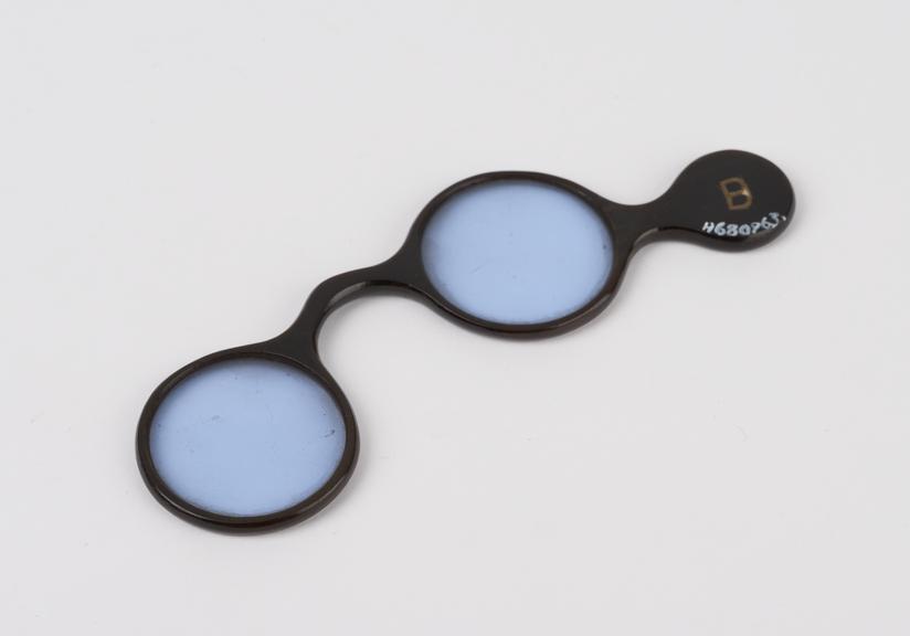 Pair of trial lenses, tinted blue, lorgnette frame