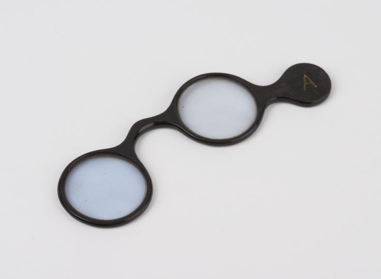 Pair of blue tinted lenses in horn lorgnette frame, inscribed A