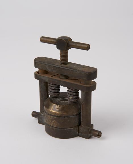 Glass eye press, brass, Portex' model, probably British