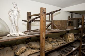 Two small pieces of wood, tied to string