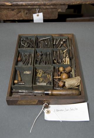 Round piece of lead, with hole through