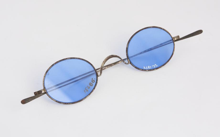 Pair of blue dark glasses with steel frames, owned by Dr