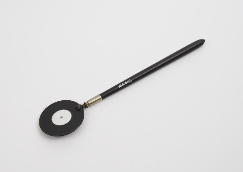 Retinoscope, mirror on brass disc with plastic handle