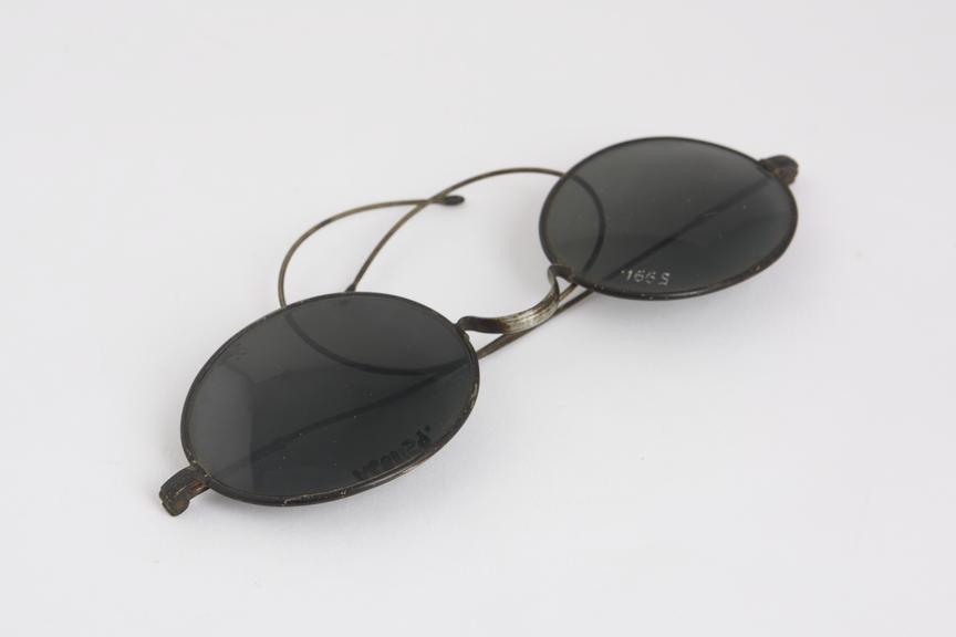 Coil spring sunglasses, silver frame, blackened lenses, English