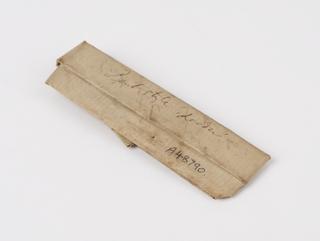 Lachrymal style wrapped in paper