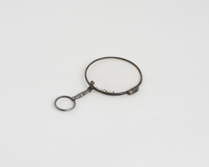 Bow spectacles, silver, one rim only, with ring handle, English