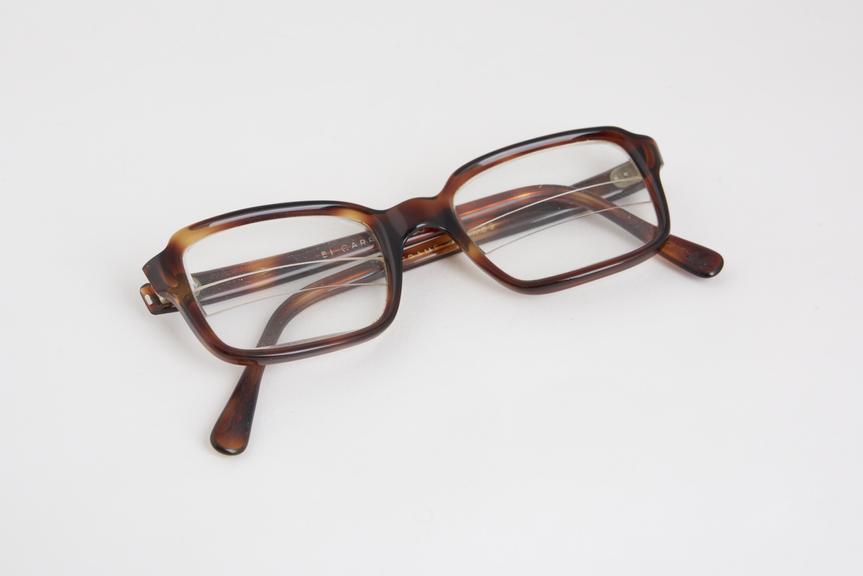 Brown plastic spectacle frames, signed E(?) Carre