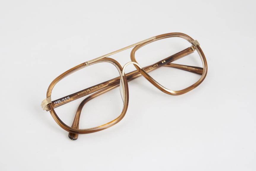 Pair of brown plastic and metal spectacle frames, named Solaris