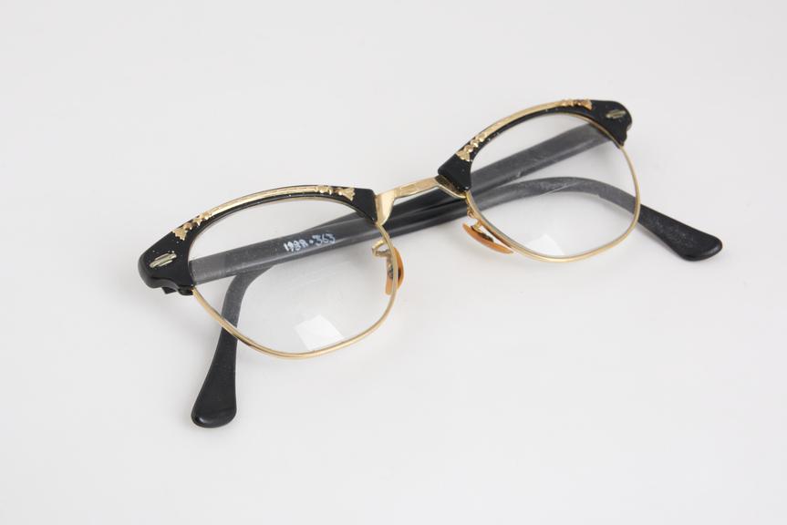 Pair of spectacles, plastic and metal upswept frames