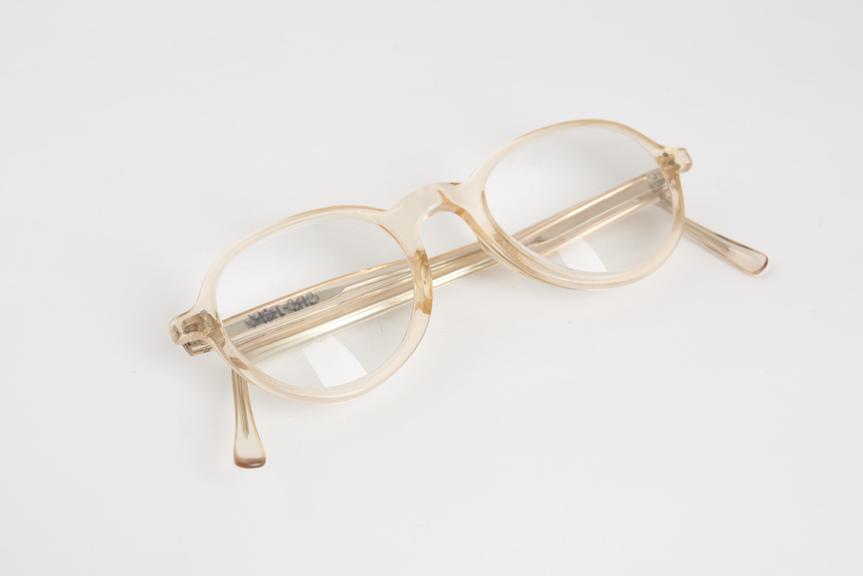 Pair of spectacles, pink plastic