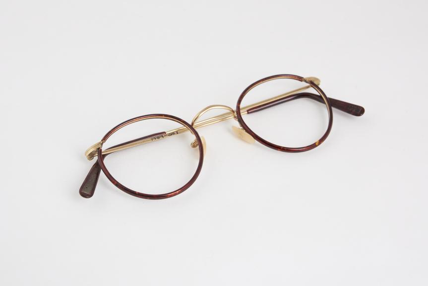 Pair of spectacle frames, brown plastic & metal