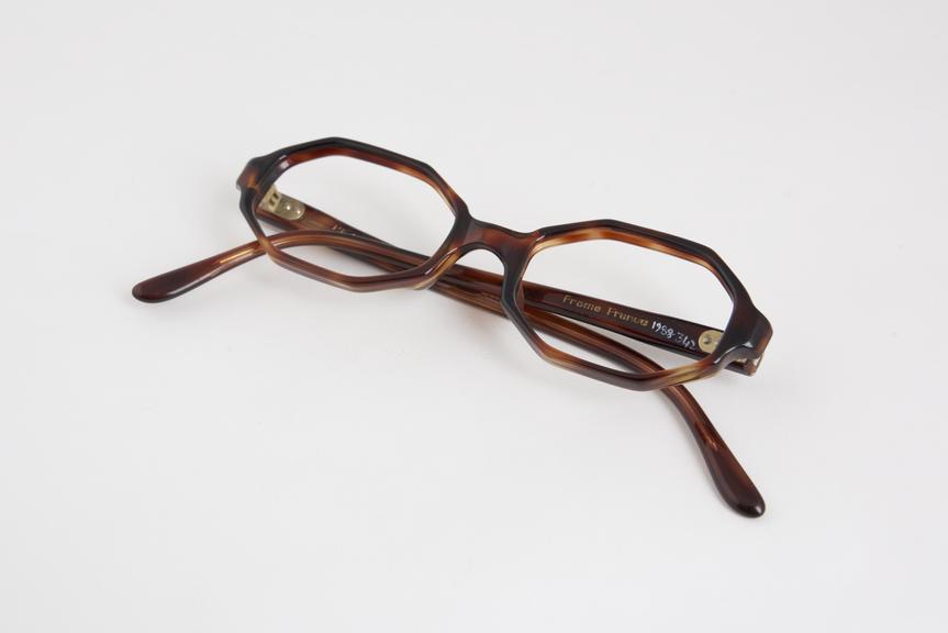 Brown plastic spectacle frames, child size, named Society Girl'