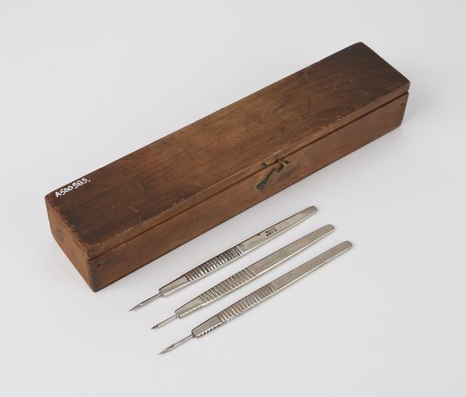 Three ophthalmic knives in wooden case by Weiss, English