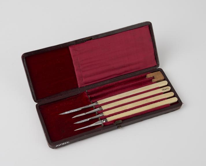 Four ophthalmic knives, cased, two by Ferguson and two by Ernst