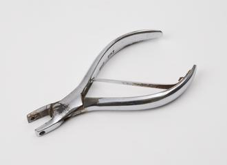 Pair of pliers with holes in the jaws used in the manufacture and fitting of spectacle frames
