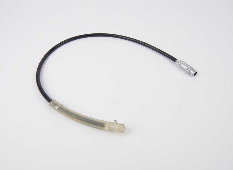 Black cable with clear tubing attached to one end