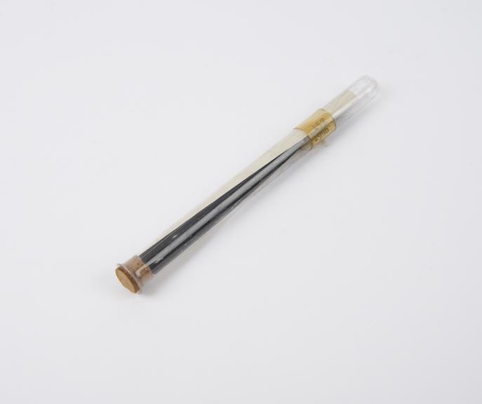 Test tube which contains a piece of photographic film