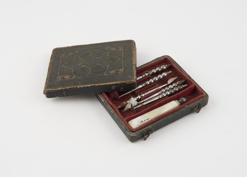 Personal dental descaler set in rectangular tooled leather