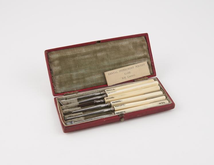 Dental descaler set, in rectangular red tooled leather covered